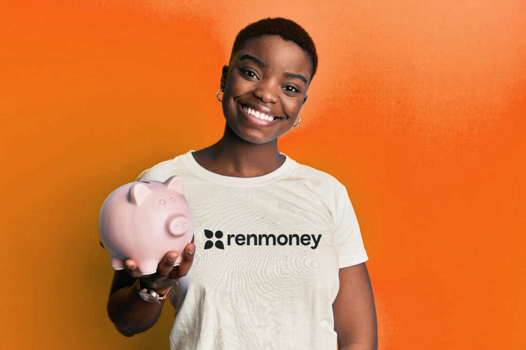 Nigerian Woman holding piggy bank savings with interest